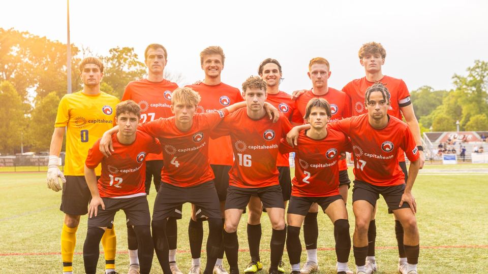 Real Central NJ men's team lined up for a photo before kickoff